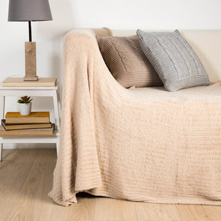 Couverture tricotée avec texture beige douce