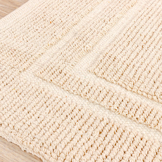 Tapis de bain tissé à la main avec cadre naturel 50x80cm.